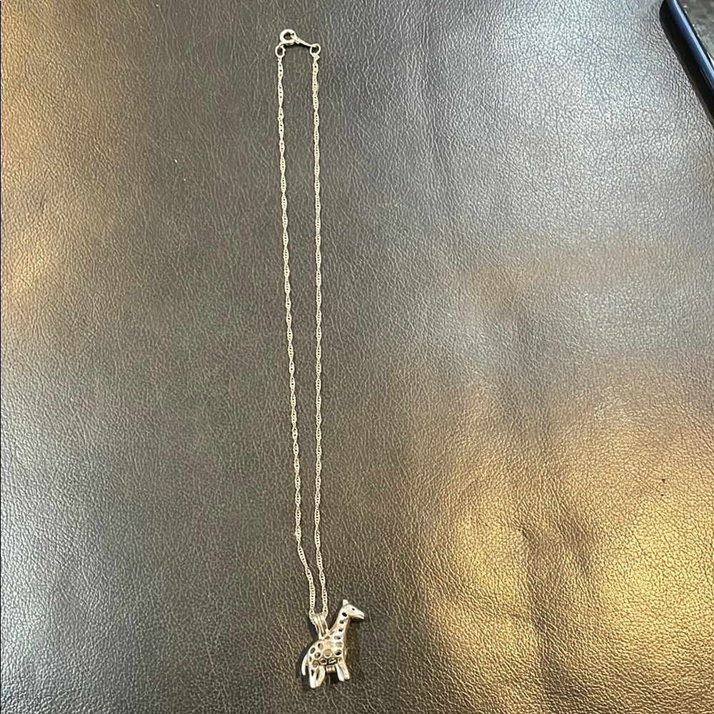 Giraffe Necklace opens up and has a pearl inside new without tag